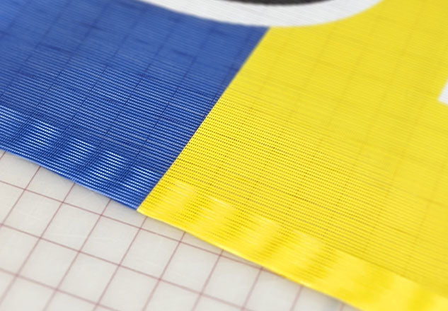 mesh banner, fence banner, mesh banner Winnipeg, wind resistant banner, fence banner Winnipeg, mesh banner Manitoba, construction banner, construction fence banner Winnipeg, construction fence banner Manitoba