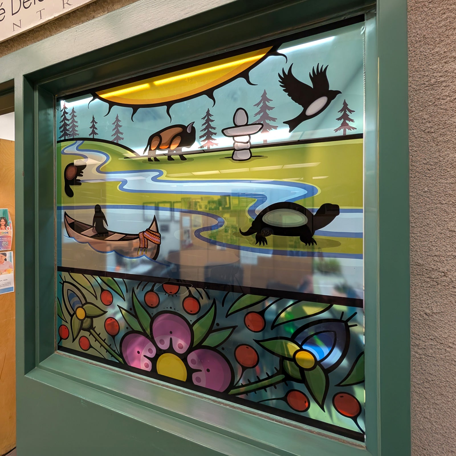 Decorative glass panel with indigenous design featuring a canoe, turtle, and other elements.
custom door decals, entrance door decal, door decals Winnipeg, custom window decals graphics stickers, perforated window decals graphics stickers, removable window decals graphics, permanent window decals graphics stickers, frosted window decals graphics, vinyl lettering, window decals graphics stickers Winnipeg, window decals graphics stickers Manitoba, window decals graphics stickers fast