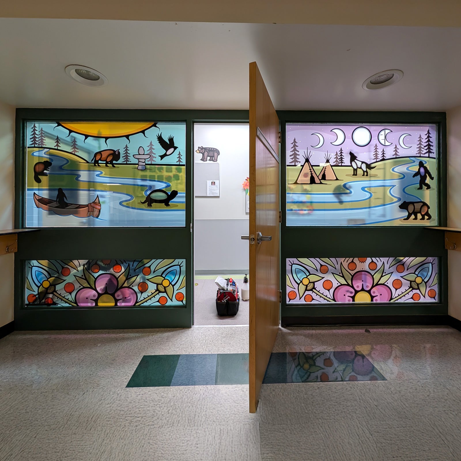 Decorative glass panels with nature-themed designs in a room.
custom door decals, entrance door decal, door decals Winnipeg, custom window decals graphics stickers, perforated window decals graphics stickers, removable window decals graphics, permanent window decals graphics stickers, frosted window decals graphics, vinyl lettering, window decals graphics stickers Winnipeg, window decals graphics stickers Manitoba, window decals graphics stickers fast