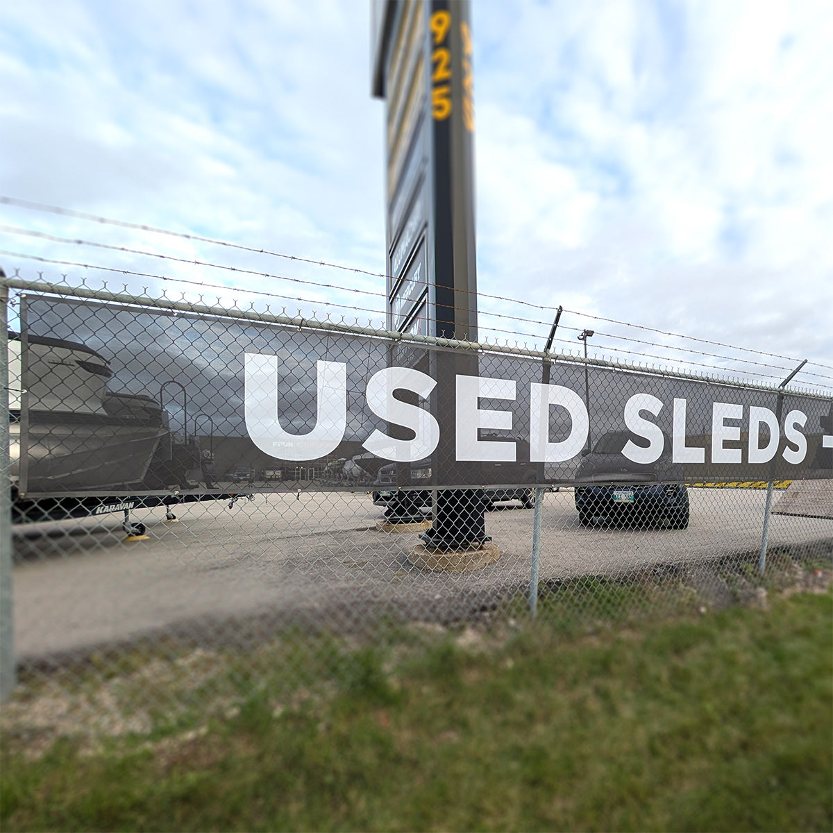 mesh banner, fence banner, mesh banner Winnipeg, wind resistant banner, fence banner Winnipeg, mesh banner Manitoba, construction banner, construction fence banner Winnipeg, construction fence banner Manitoba